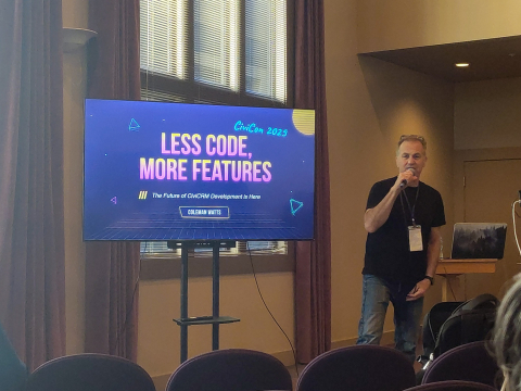 "Less Code, More Featues" title screen in neon colors presented by enthusiastic Guy